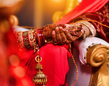 A Closeup of hands with henna tattoos during an Indian traditional wedding ceremony, kanyadan ritual